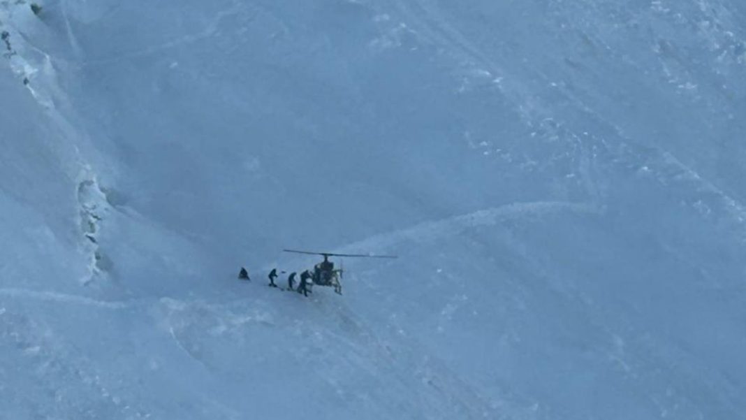 Army pilots evacuate casualty at 18,600 feet near Nun Kun An Indian Army helicopter holds on a steep snow slope near Nun Kun during a high-altitude casualty evacuation