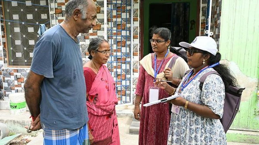 Census 2027 brought forward in four poll-bound states Census enumerators speak to residents. Photo via The Hindu